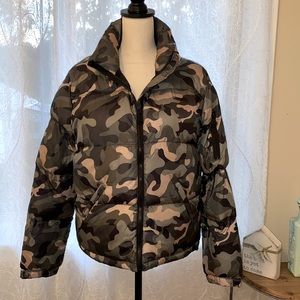 Camouflage print puffer jacket in a quilted design.
